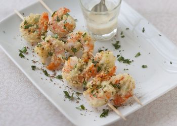 Skewered Prawns With Lime Butter Sauce, Rice And Raw Vegetables