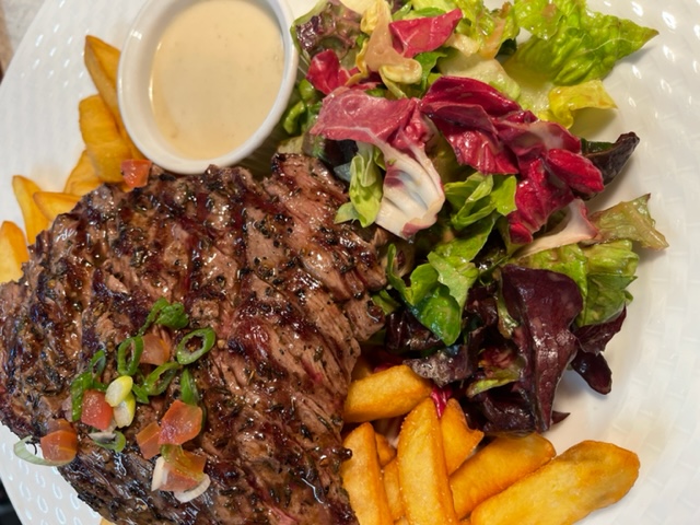 Grilled ribeye, pepper or Roquefort Cheese Sauce, French Fries And Salad                       