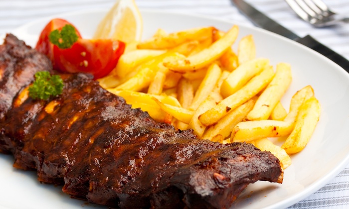 Ribs with BBQ sauce and fries